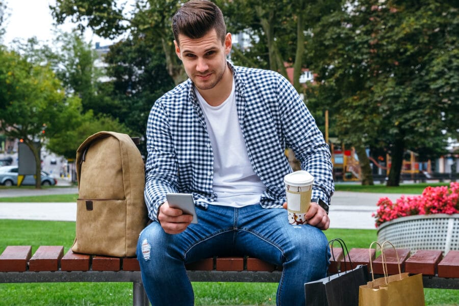 man with mobile looking camera X6S9DR7